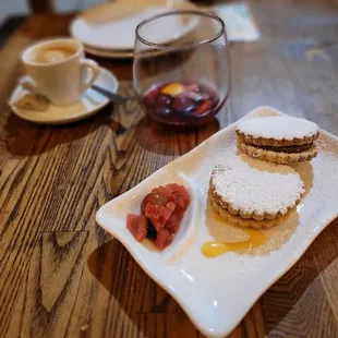 a plate of pastries and a cup of coffee