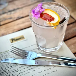 a grapefruit cocktail with a slice of grapefruit
