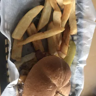 a hamburger and fries in a basket