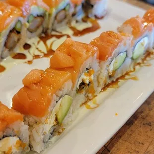 Dragon roll (top) and philly roll (bottom)