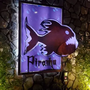a sign for piranha