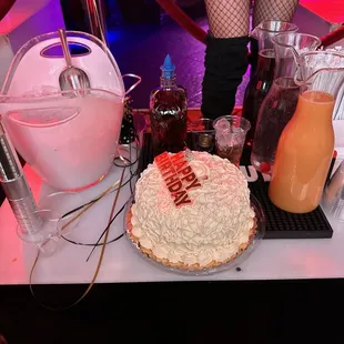 a cake and drinks on a table