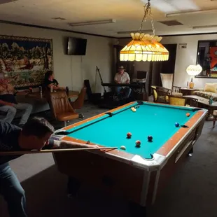 a man playing pool