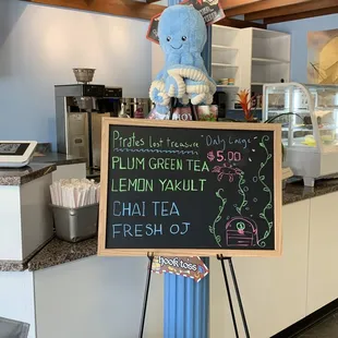 a chalkboard sign for a tea shop