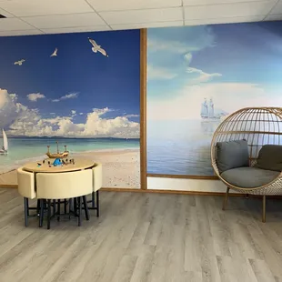 a living room with a view of the ocean