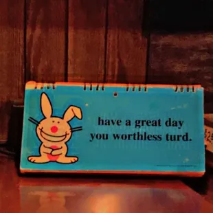 a sign that says have a great day you worthless tired