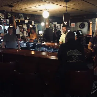 a group of people sitting at a bar