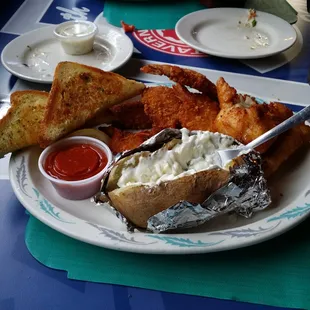 Yummy fish, shrimp, potatoes and fish.