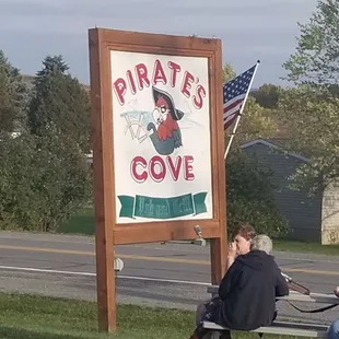 a group of people sitting on a bench