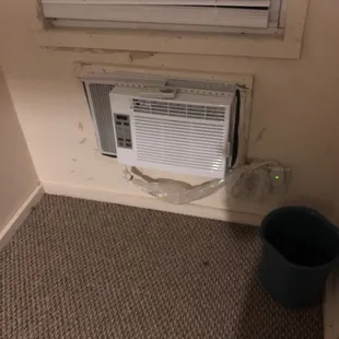A/c looks like it ready to fall out the wall