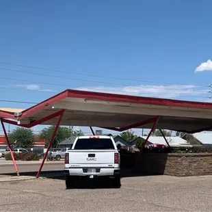 a truck parked in front of a restaurant