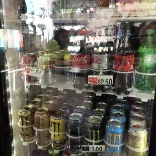 a refrigerator full of sodas and soft drinks