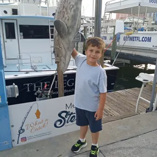 Jayse hanging out with A Fish called Stella from the Charter fishing boat The Legend.