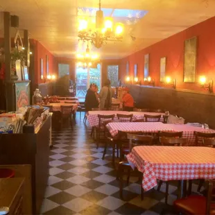 a dining room with tables and chairs