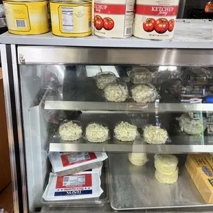 a display case filled with muffins