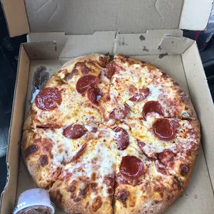 a pepperoni pizza in a box