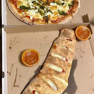 a pizza in a cardboard box