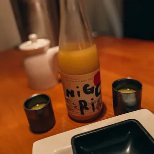 a bottle of pisces sushi on a table
