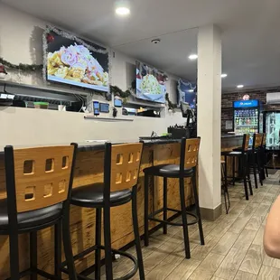 a woman sitting at a table in a restaurant
