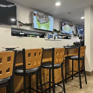 a row of bar stools in a restaurant