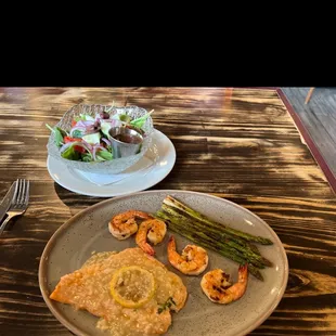 Yummy!  Salmon with garlic sauce, grilled shrimp &amp; asparagus.  My salad takes the places of the yucca.