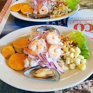 Ceviche Mixto served with sweet potatoes and corn.