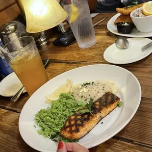 Salmon with cilantro rice and garlic whipped potatoes.