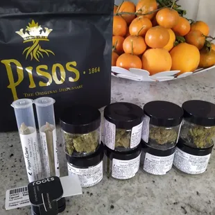 Oz of weed in 3.5g containers, and two pre rolls, and a container of concentrate