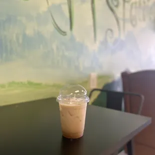 a cup of coffee on a table