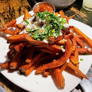 Papas Fritas: fries with garlic and cotija cheese