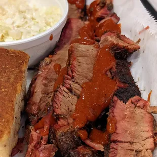 1/2 lb Beef Brisket. Part of the 2 Meat Combo and 2 Sides and Bread ($20.60).