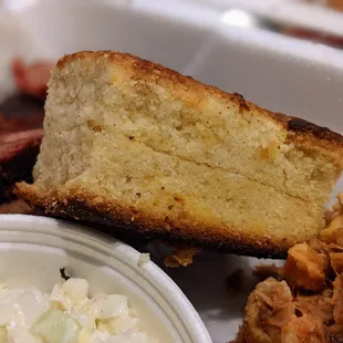 Cornbread cake. Part of the 2 Meat Combo and 2 Sides and Bread ($20.60).