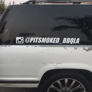 a white truck parked in a parking lot