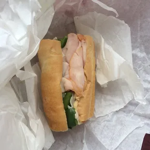 a chicken sandwich in a wrapper