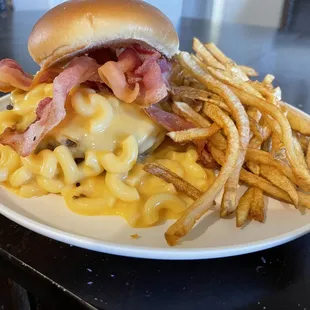 Mac Attack! Yeah, that burger is 1/2 pound of juicy meat smothered in Mac and cheese, bacon, and why not... more cheese.