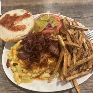 WTF burger, hamburger patty with macaroni and cheese, pulled pork, and bacon on top. Definitely have to eat this one with a fork and knife.