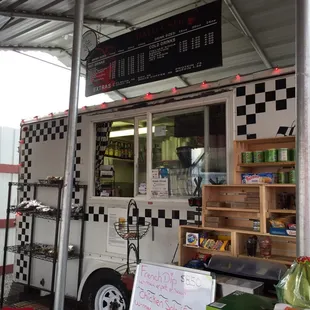 a food truck with a menu on the side