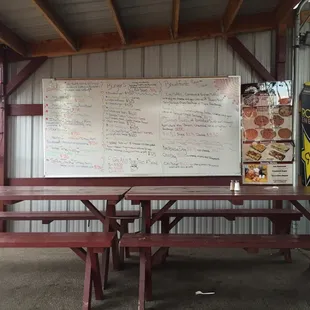 a picnic table with a menu on it