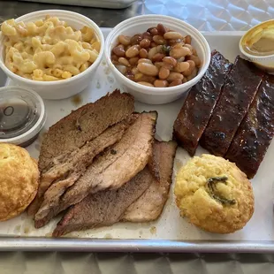 1/4 Brisket Platter and 1/4 rack Ribs platter with Mac and cheese, beans, cornbread and sauces