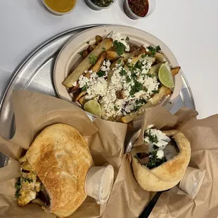 Chicken kabob pita, gyro pita, and feta fries