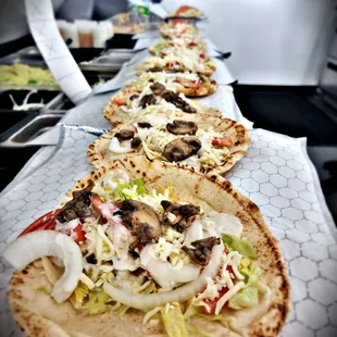 a row of pita sandwiches