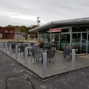 View of outdoor seating. Old produce building can be seen in the background across the street.