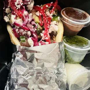 Roasted Chicken Pita w/ red cabbage slaw, chopped cucumbers, tomato &amp; cucumber salad, olives, feta cheese, pickled onions, hummus!!