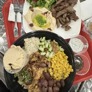 Top: Gyro Plate Bottom: Chicken Shawarma Rice Bowl- I added Baba ghanoush, corn, cucumber, olive, and a side of hummus