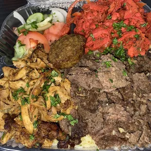 a tray of meat and vegetables