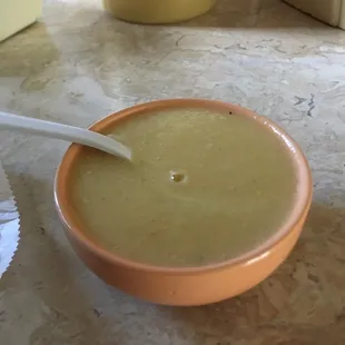 a bowl of soup with a spoon in it