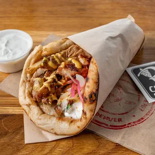 A delicious pita wrap with grilled chicken.