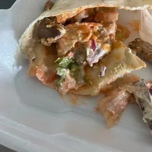 Nasty "gyro" with mystery orange sauce, no tzatziki, no feta.