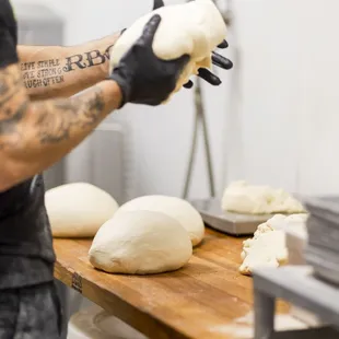 Homemade Pita dough being made by Jared at Pita Fusion