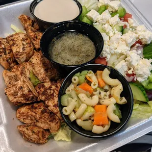 Chicken Shawarma Plate. Chicken shawarma served with Greek salad and tahini sauce. And more. $13.75.